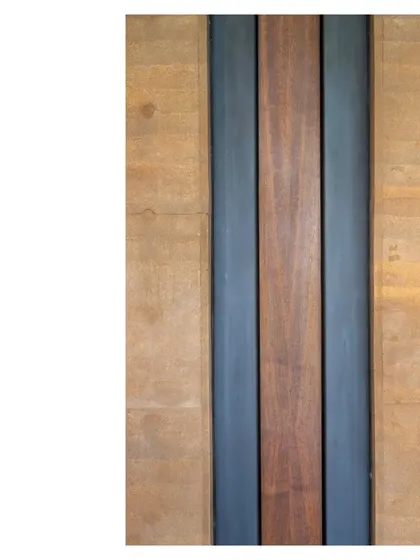 Like manners maketh man, details make architecture. This close up from the Lakeshore house shows the junction of rammed earth, steel, and wood. Build quality, craft, and material are the tools that turn building into art.