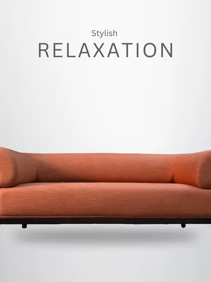 A full view of the stylish orange sofa, showcasing its sleek wooden frame and contemporary silhouette.