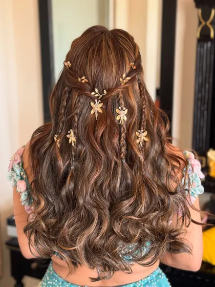 We created this gorgeous carnival hairdo with beautiful curls and whimsical golden dragonfly accessories. Hair is a crucial part of the look, and we curate it to perfection.