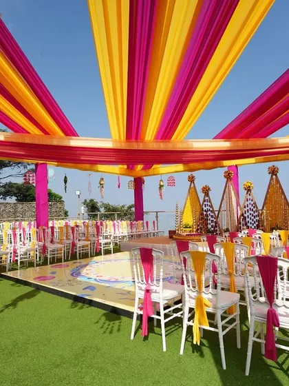A wide view of the entire seaside Haldi setup, showing the stage, guest seating, and the stunning ocean view. We ensure every element comes together for a cohesive and beautiful event.