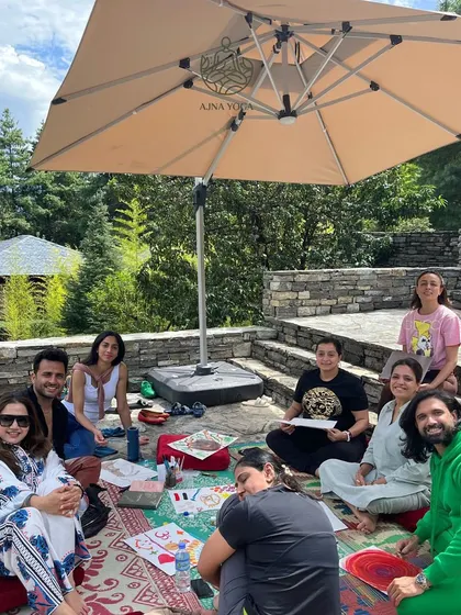 Our wonderful group enjoying an outdoor creative session during the Bhutan retreat. These journeys are about building a community, or sangat, and sharing transformative experiences together.