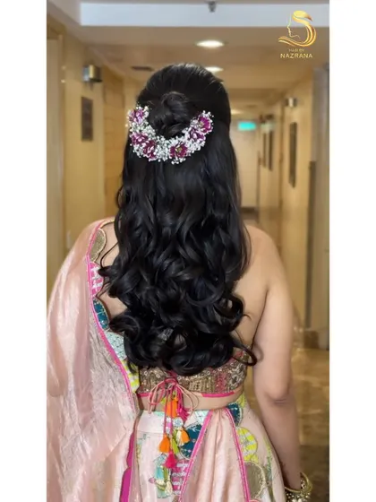 Another angle of the floral half-updo, a romantic choice for any pre-wedding event.