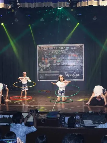 A creative formation using hula hoops, showing how we incorporate props to make performances fun and unique.