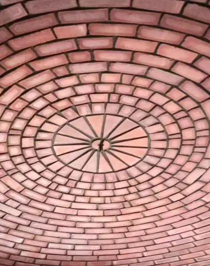 The concentric rings of the brick dome create a mesmerizing pattern when viewed from directly below.