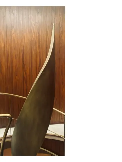 A detail of a spiral staircase, where the aged brass handrail becomes a pure, sculptural ribbon. We love these little details; the overall project is but a collection of well matched and fitted parts.