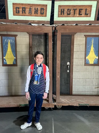 Cade looking proud with his medals after becoming a National Champion on Rings and placing 2nd on Vault.