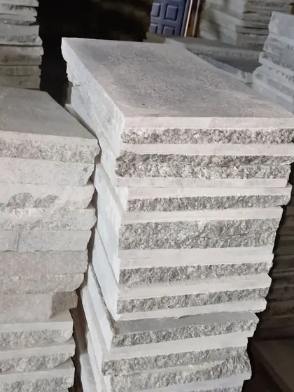 A side view of stacked Bangalore stone, showing the consistent thickness of my machine-cut products.