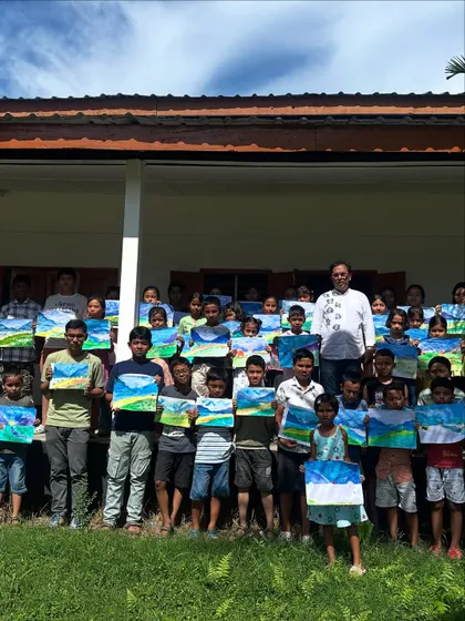 My students at Gogamukh College proudly displaying the landscape paintings they created during our workshop. It is so rewarding to see them all holding their finished artwork.