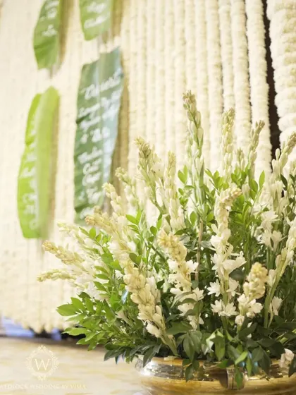 A creative and sustainable detail for a South Indian wedding. We used banana leaves with beautiful calligraphy as menu cards, adding an authentic and eco-friendly touch.