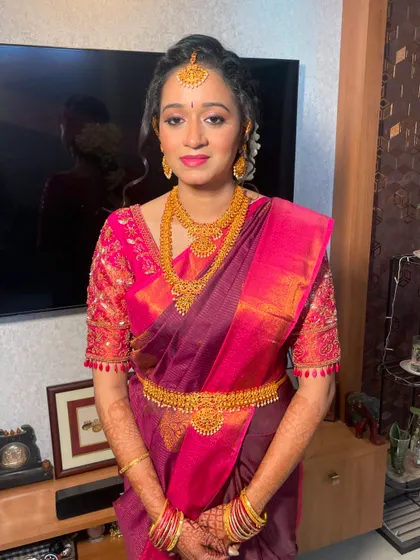 Another angle of the Tamil engagement look, showcasing the beautiful hair and makeup that complete her traditional attire.
