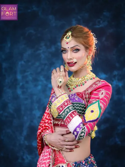 This pose highlights the intricate jewelry and the details of the makeup. It's a celebration of color, tradition, and beauty.