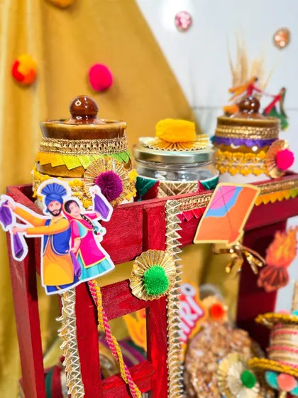 Detail shot of the decorated jars on our Lohri manji hamper, showcasing the colorful and traditional embellishments.