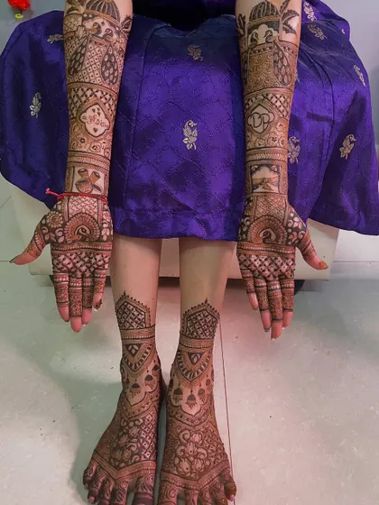A combined view of the bride's hands and feet, showcasing the coordinated and intricate designs.