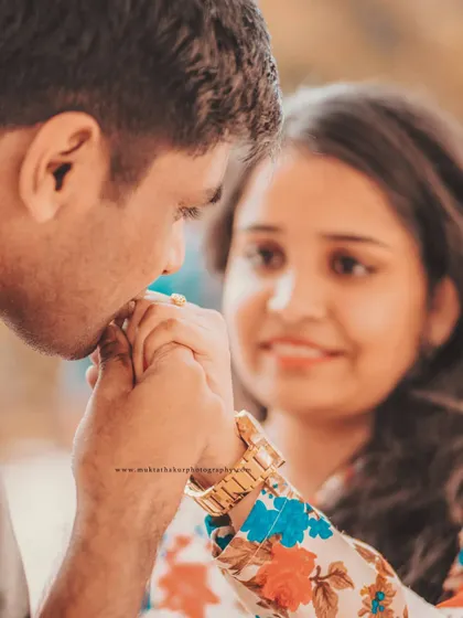 A gentle, romantic gesture during a pre-wedding session. This close-up highlights the tenderness and affection that tells your unique love story.