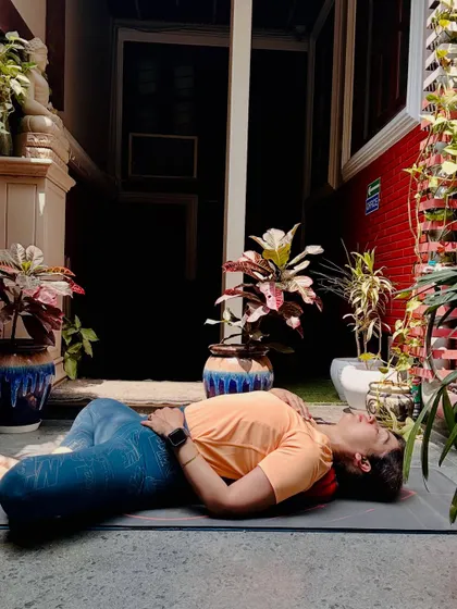 This is Supta Baddha Konasana, or Reclined Butterfly Pose. It is a deeply restorative posture that I recommend for stress relief. It allows your back to melt into the mat and your breath to deepen, signaling to your body that it is time to let go.