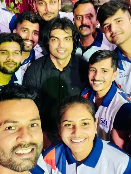 Surrounded by champions, we breed champions. A proud moment taking a selfie with India's Golden Boy, Neeraj Chopra, and my dedicated team of athletes at the Sports Authority of India, Bangalore. His journey is an inspiration for all of us.