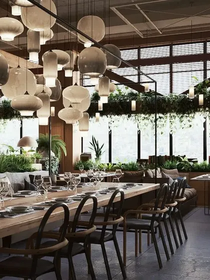 An identical wide view, highlighting the interplay of natural light, interior lighting, and plant life.