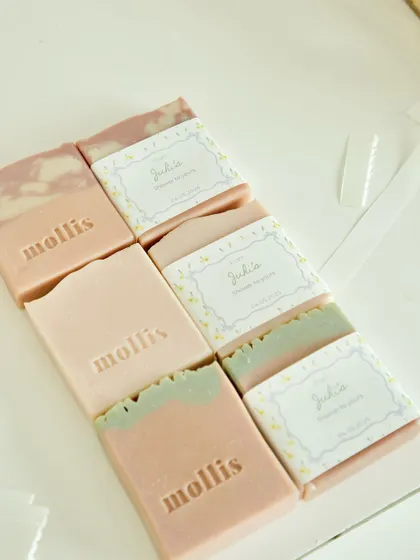 Before and after: unstamped soaps next to the final, custom-wrapped favors for the Amsterdam baby shower.