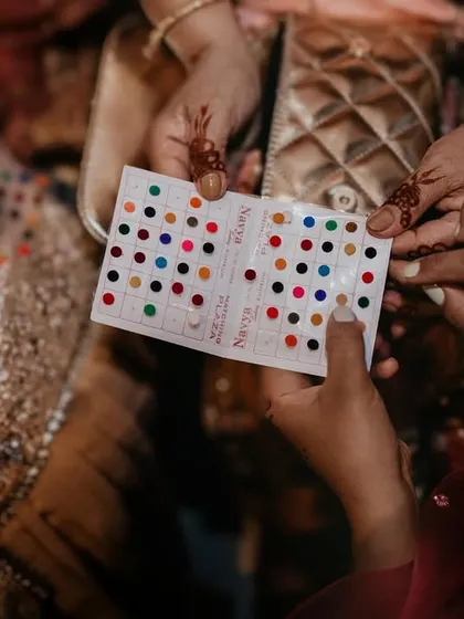 A small, colorful detail. The sharing of bindis is a moment of connection and tradition that I love to capture up close.