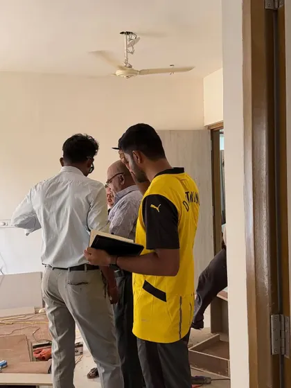 A team huddle on-site to ensure everyone is aligned on the day's tasks.