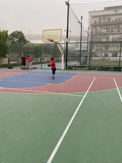 A lone player practices dribbling, showing the individual dedication that builds great players.
