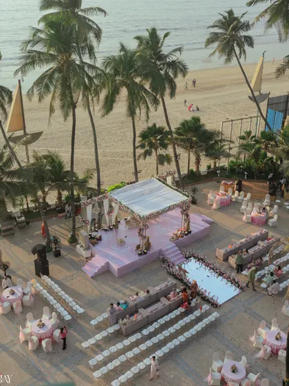 An aerial view of the beautiful beach wedding setup, with the mandap overlooking the ocean.
