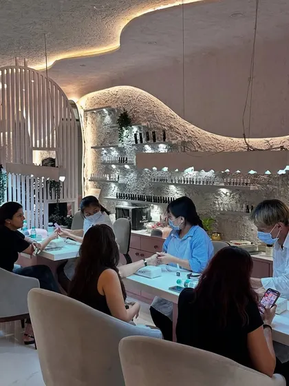 Our open layout was designed to feel both spacious and intimate. You can see clients and technicians interacting in a relaxed environment, which is exactly the community feel I wanted to build.