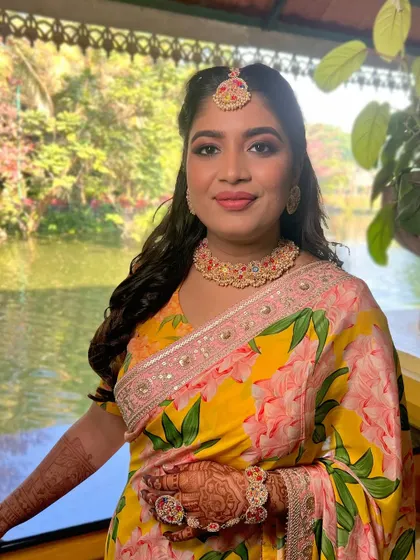 A close-up of the Haldi look, her smile radiating happiness and her skin glowing.
