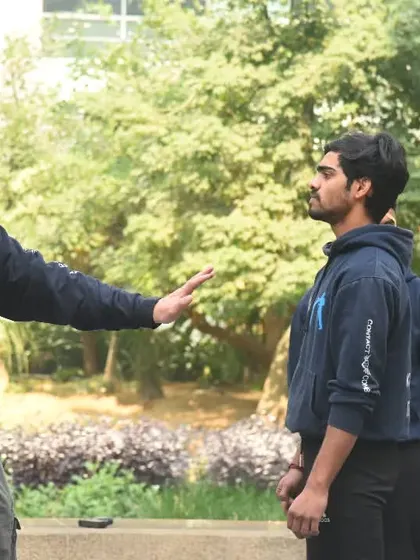 Every training session starts with the basics. Here, I am teaching the fundamental fighting stance and guard. A solid foundation is crucial before you can move on to more advanced self-defense techniques.