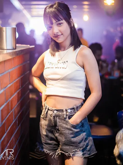 A guest posing at the bar.