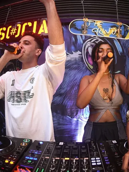 Me and a guest artist on the mic together. The energy of collaboration is powerful.