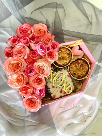 A beautiful gift box with fresh roses, mini apple crumble pies, and a brownie slab. Perfect for a romantic occasion.