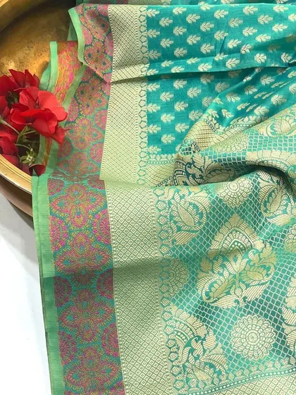 The border of our Chanderi saree. This angle highlights the intricate patterns and the blend of colors along the border, demonstrating the fine craftsmanship of the weavers.