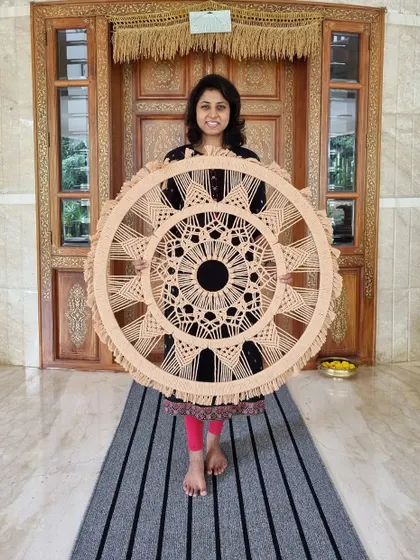 This immense macrame mandala was a labor of love, taking over 18 hours of meticulous handiwork. Every knot and pattern was customized to create an extraordinary piece of wall art for our client.
