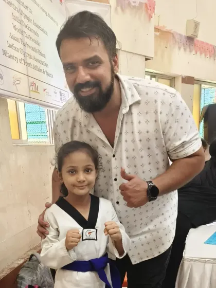 Zainab Shaikh with Aseem Singh Sodhi, the organizer of the championship. Her talent is recognized by leaders in the Taekwondo community.