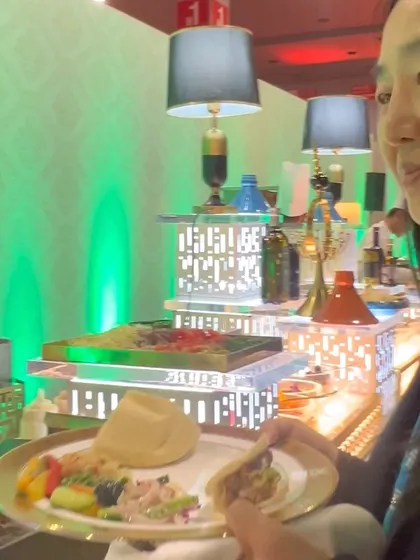 An international delegate enjoying her plate at one of our buffet stations. We strive to offer a diverse menu that appeals to a wide range of global palates.
