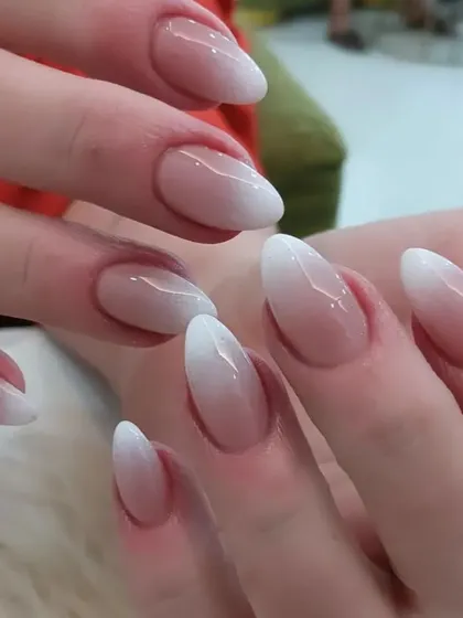 A close-up view of our almond ombre nails, highlighting the smooth gradient and healthy-looking cuticle work.