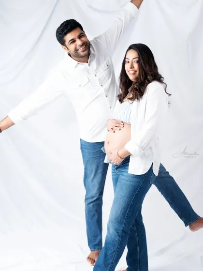 A fun and energetic pose. We encourage our clients to be themselves and have fun, which results in photos full of personality like this one.