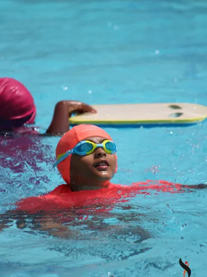 Action shots from our kids' classes, showing students practicing different strokes and building their endurance in the water.