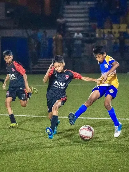 Battling for possession in the midfield during the U13 semi-finals of the Thane Youth League.