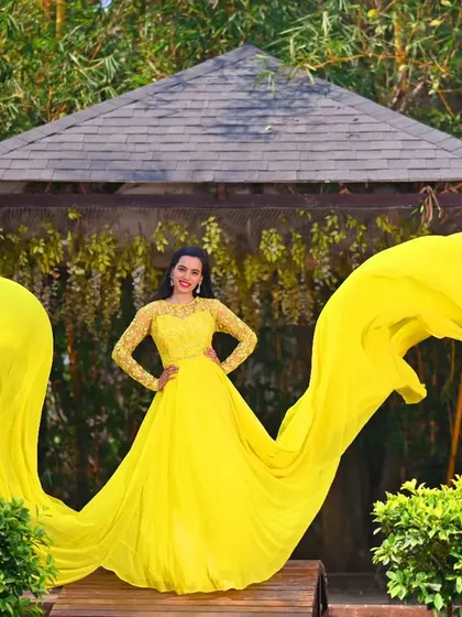 A solo portrait of the bride-to-be, showcasing the full glory of this yellow flying gown. I styled her with elegant makeup and hair to complete this stunning look.