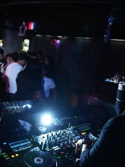 An over-the-shoulder view of my DJ setup. This is the command center where I control the music and the energy of the room.