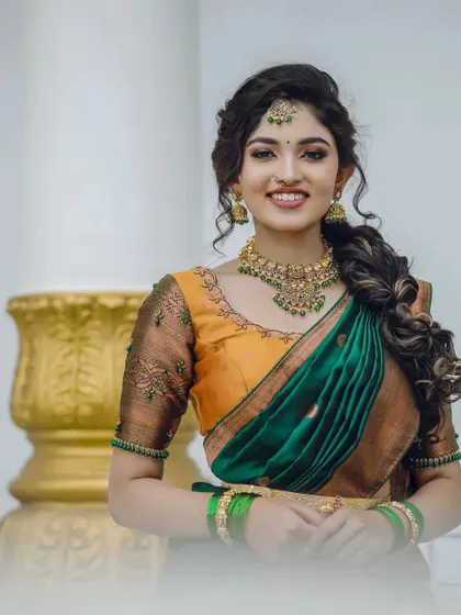 A smiling portrait of Rachana Inder in the mustard and green half-saree. This shows how the outfit brightens up the wearer's face, making it great for photos.