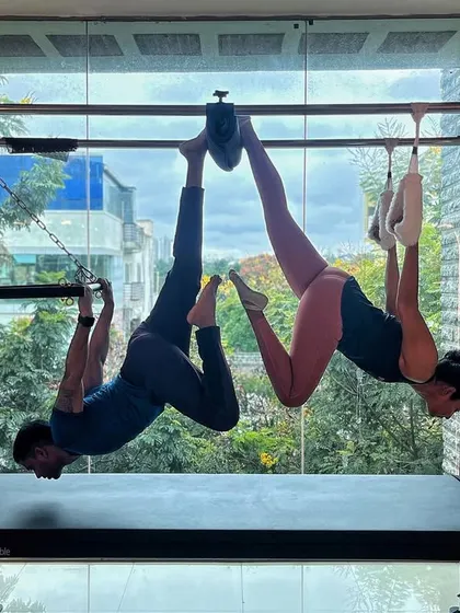 Pilates can radically enhance mental, emotional, and spiritual well being. This partner hang on the Cadillac is a perfect example of trust and connection.