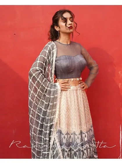 The full look of the grey and cream georgette lehenga, complete with a matching dupatta with a geometric pattern. A sophisticated choice for a modern event.