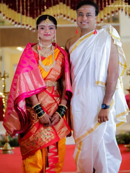 A formal portrait of the couple in their traditional wedding attire. We ensure we capture these classic shots for the family album, paying close attention to posing and detail.