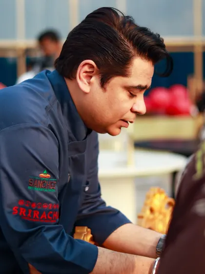 A photo of me, Chef Vikas, focused on my craft during an event.