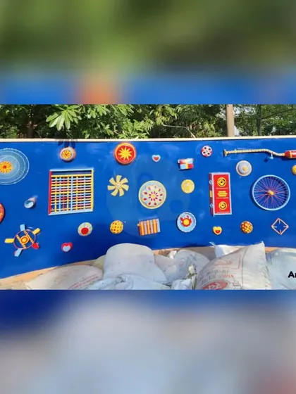 This vibrant and playful musical wall installation was created for a client in Gurgaon. It features various colorful, abstract shapes and objects mounted on a bright blue panel.