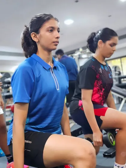 Players perform weighted lunges, a fundamental exercise for developing leg strength, balance, and stability for on-court movements.