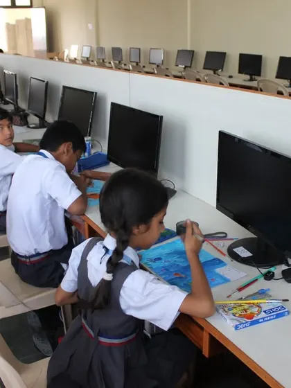 A long shot of the computer lab at St. Clare's School Unit II, filled with students during the 2023 Olympiad.